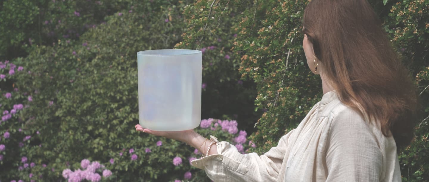Gabi holding a pearl bowl in garden